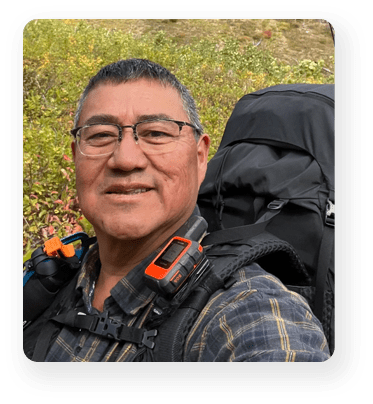 A man with glasses and a backpack