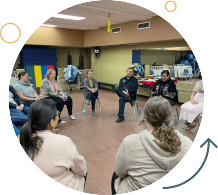 A group of people sitting in a circle.